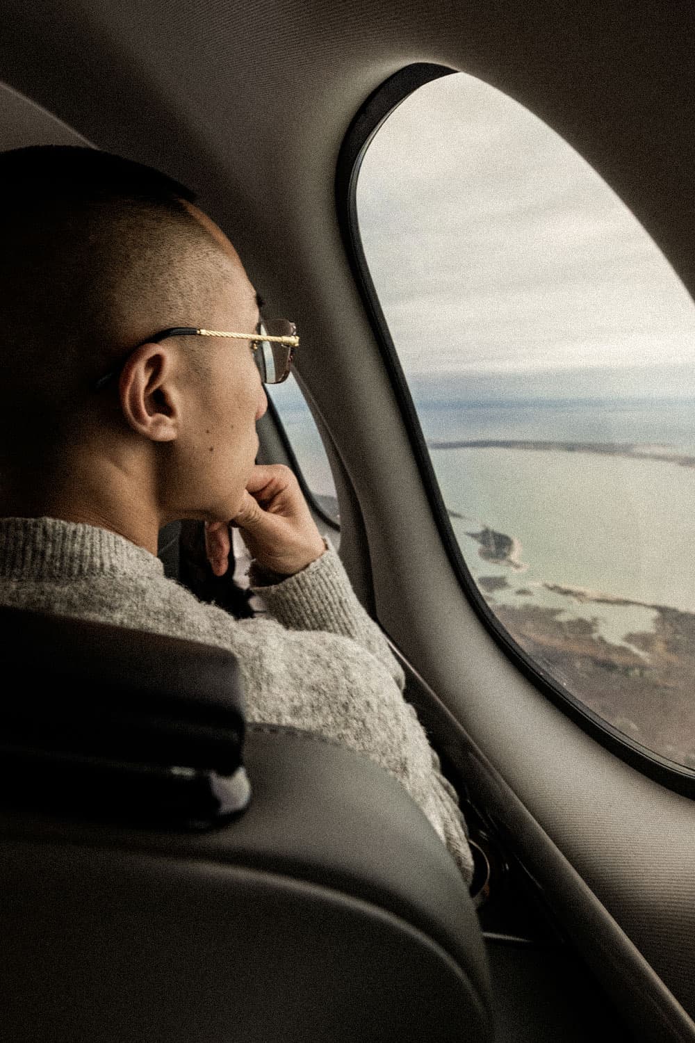 Flyte Hops aircraft flying over a scenic coastal area